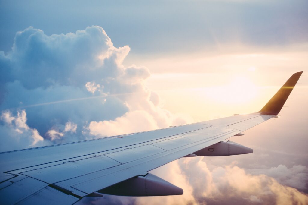 View of plane wing in the clouds