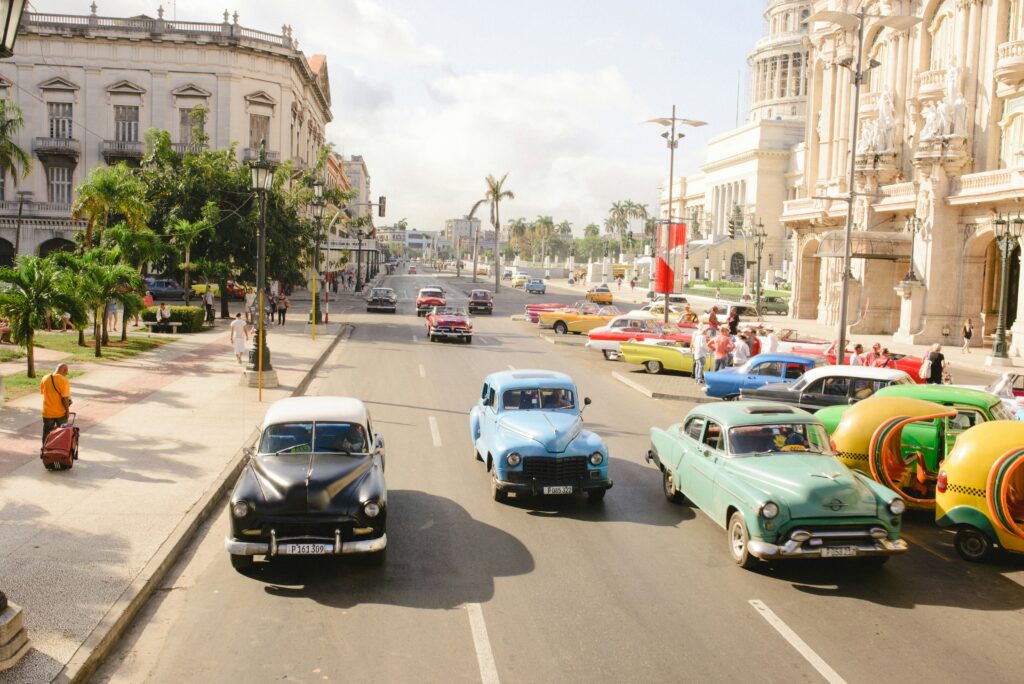 colourful cars on main road in Havana