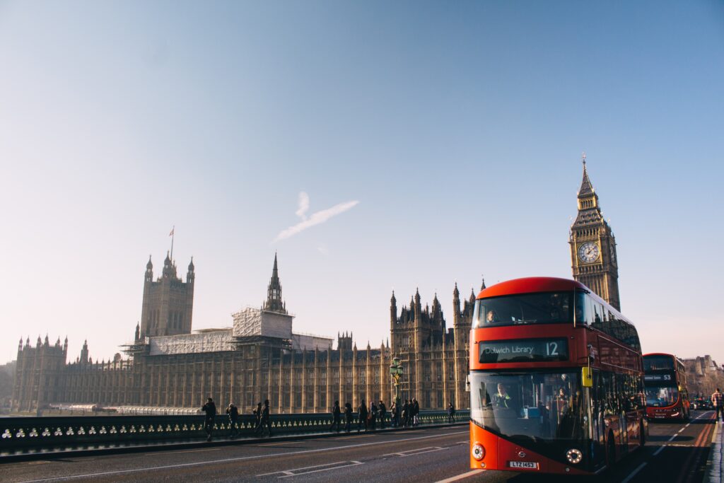 London red bus with Big Ben in background
