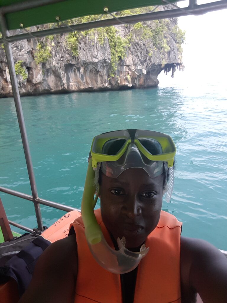 A boat in Emerald cave, Trang and picture of me in snorkel and vest