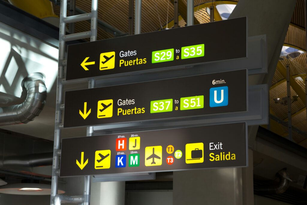 Signs showing directions to gates at an airport